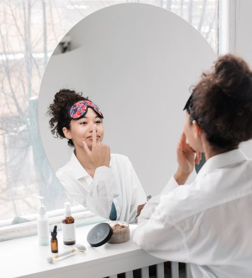 A woman feeling energized and balanced in a bright, clean room.